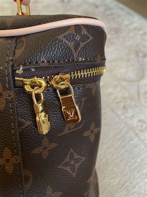 louis vuitton real vs fake clasp|louis vuitton fake.